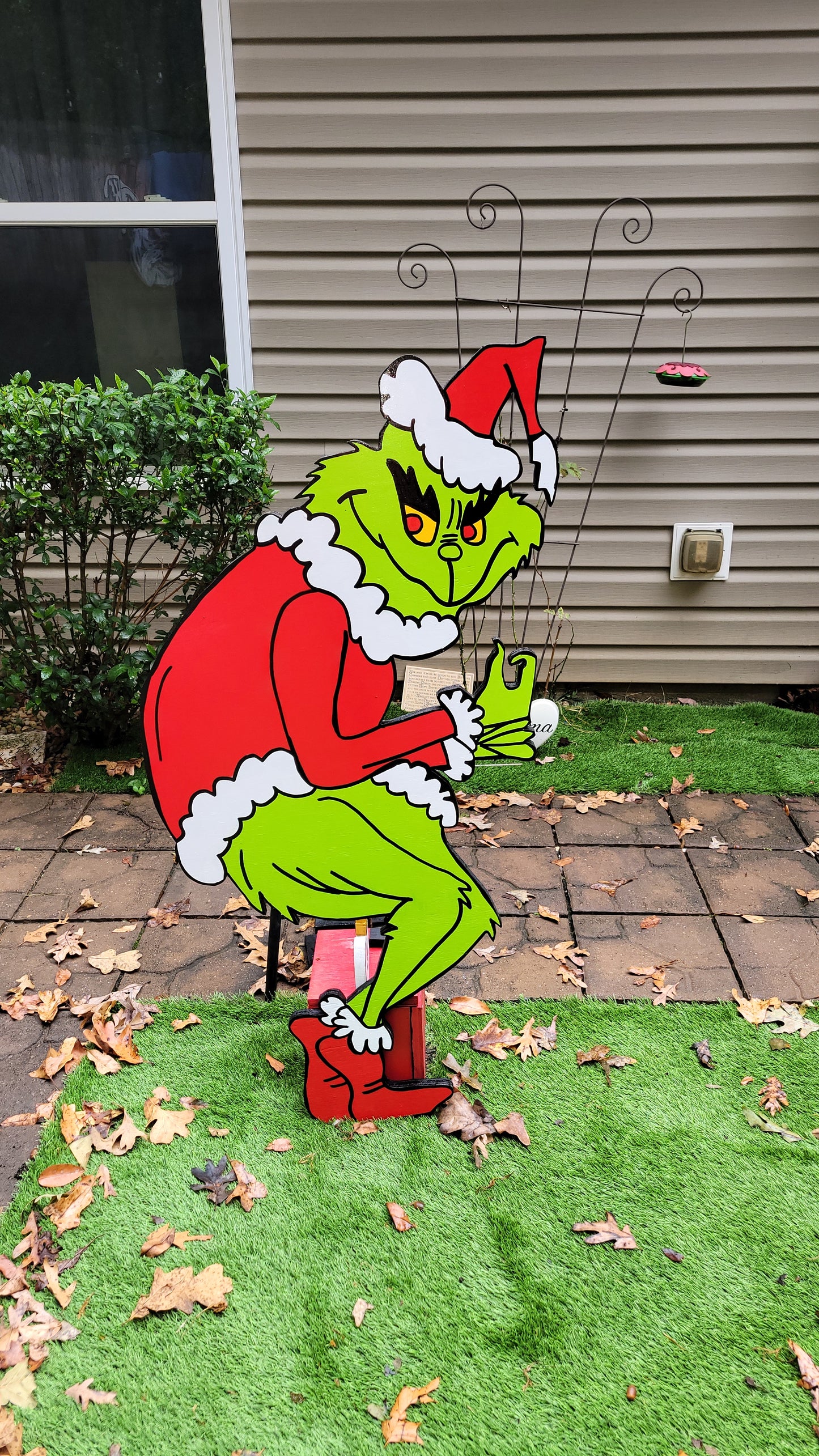 Grinch steeling Christmas lights. Lifesize yard art