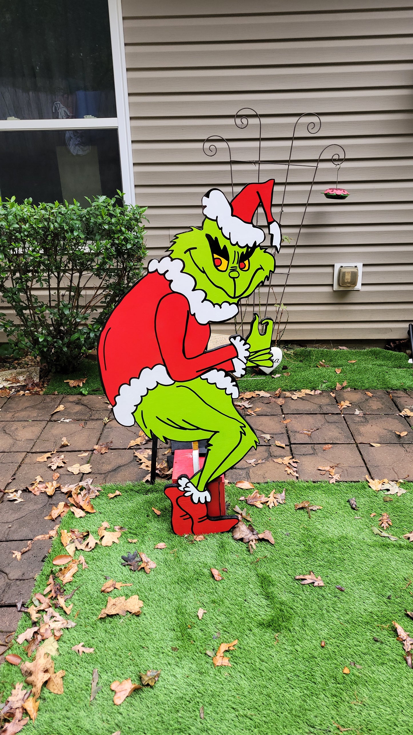 Grinch steeling Christmas lights. Lifesize yard art