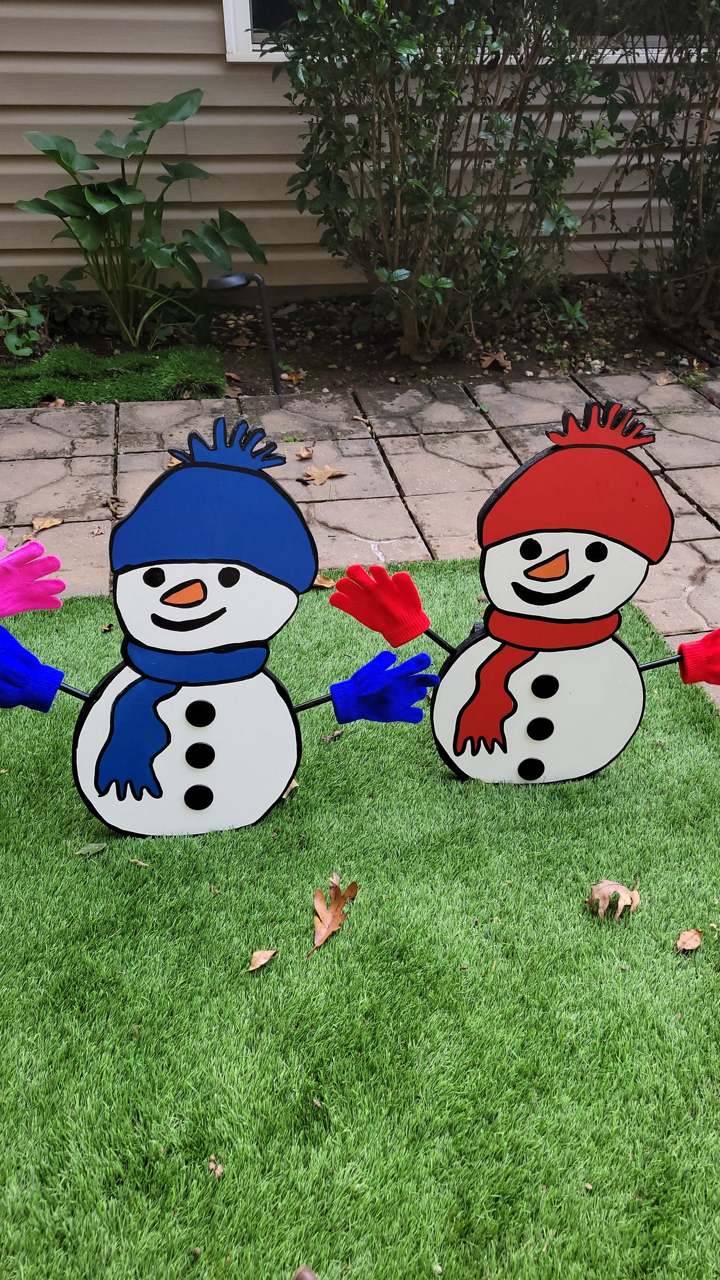 Snowman family Christmas yard art display