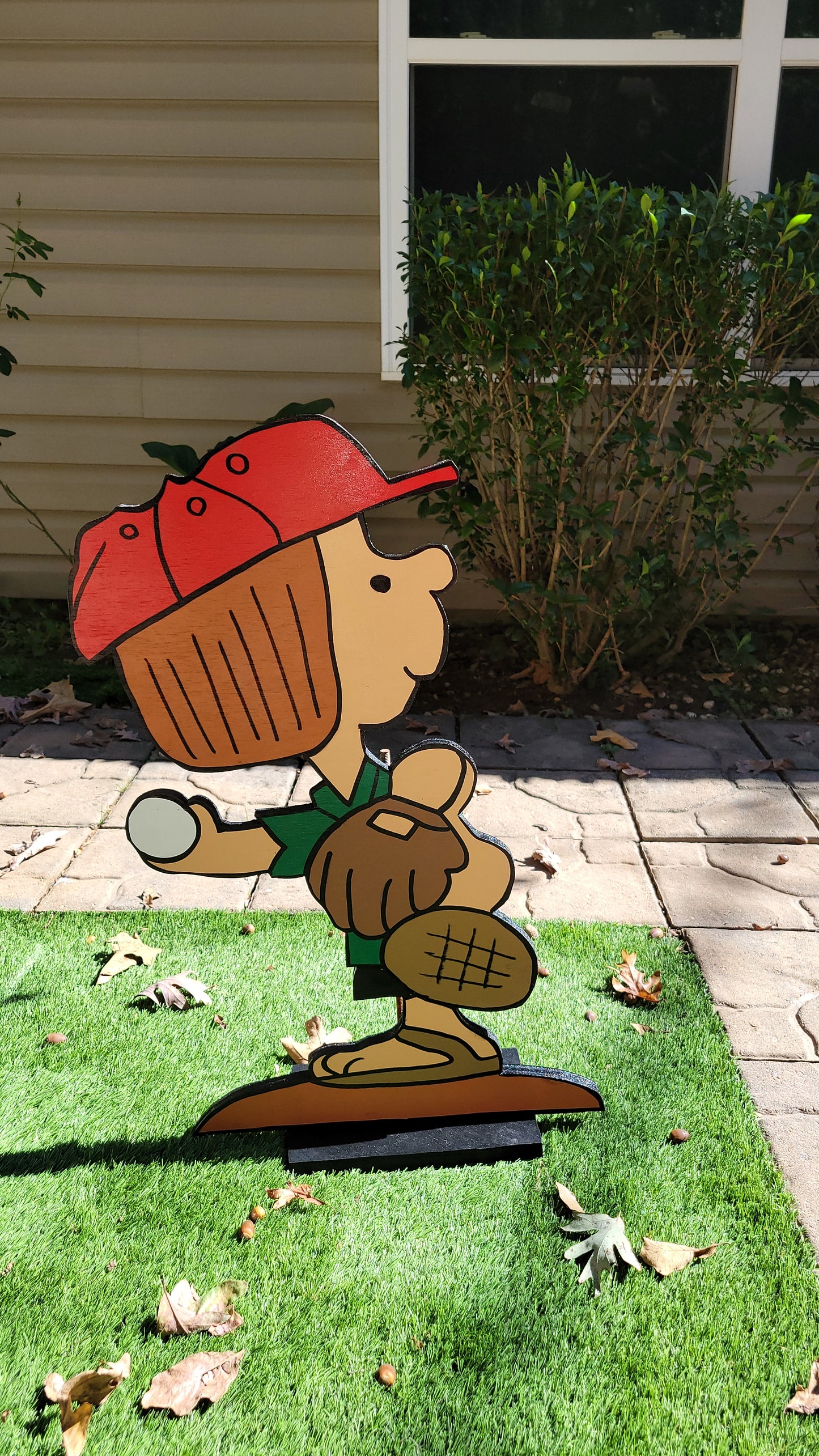 Peppermint Patty playing baseball yard art