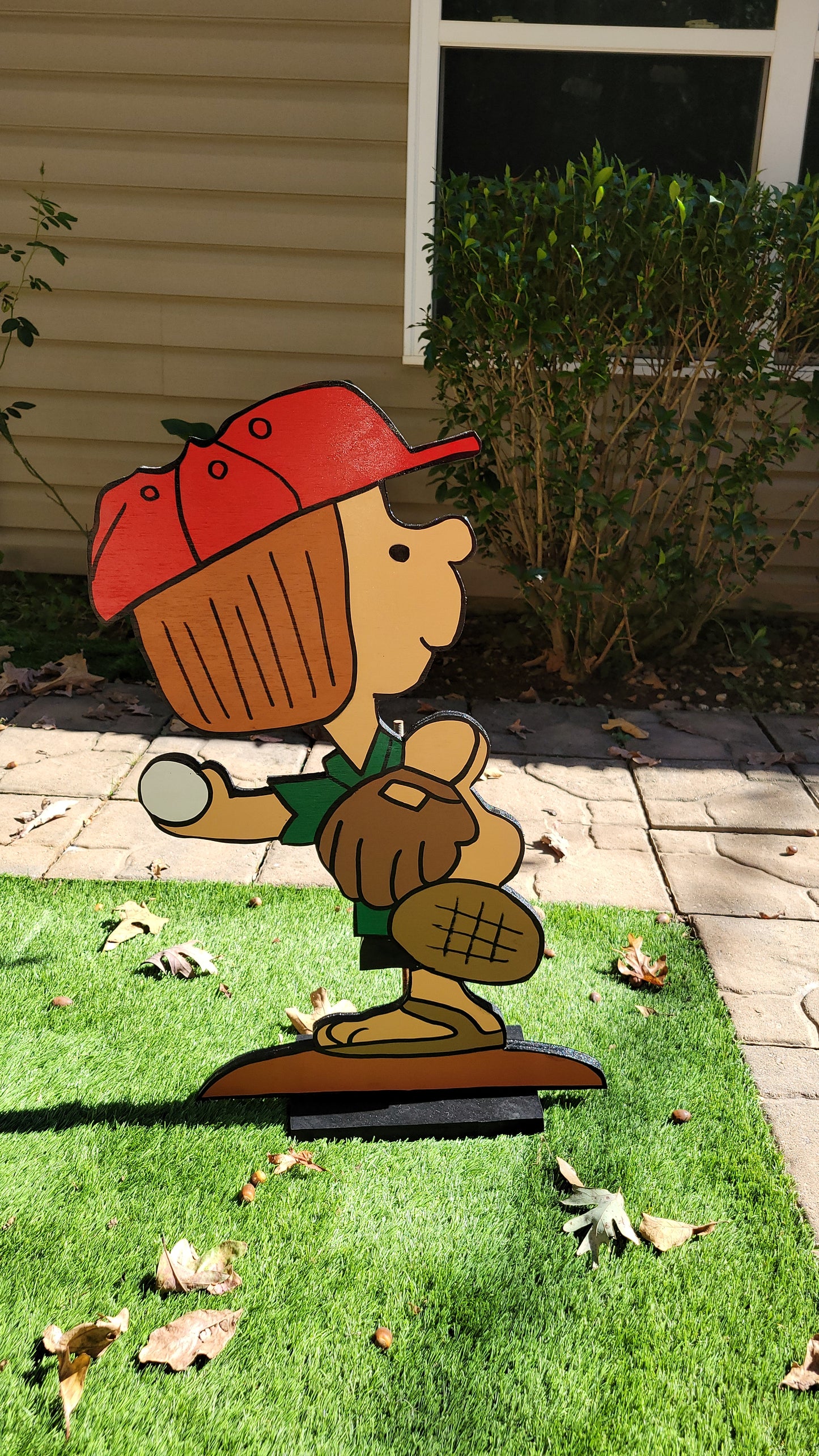 Peppermint Patty playing baseball yard art