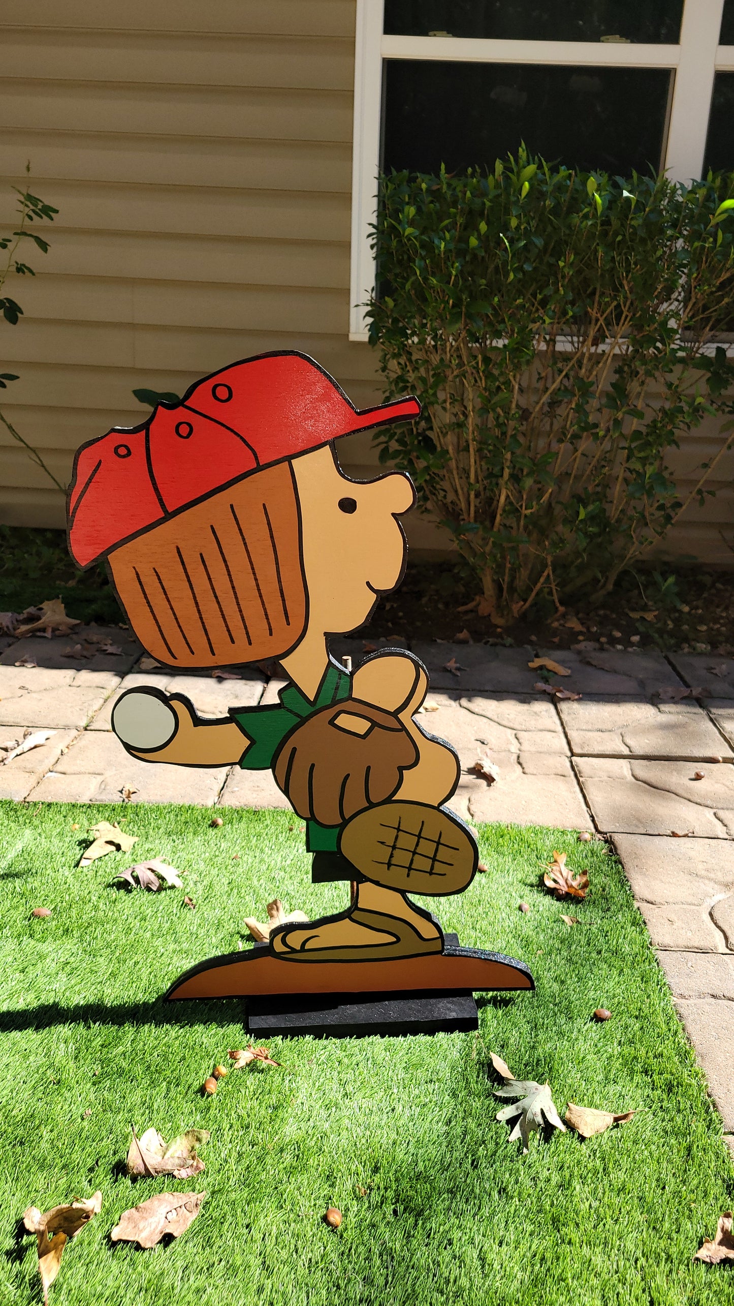 Peppermint Patty playing baseball yard art