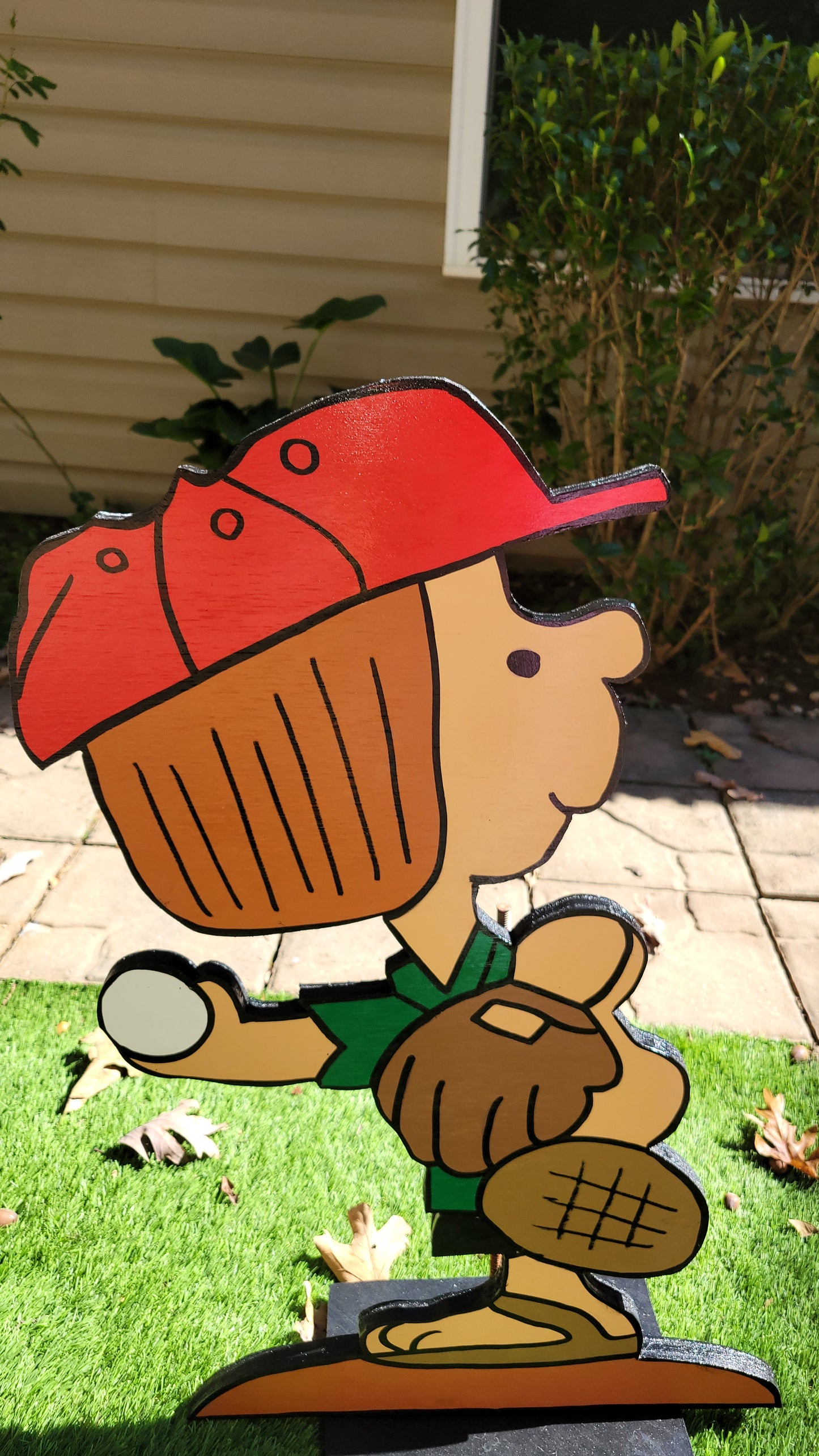 Peppermint Patty playing baseball yard art