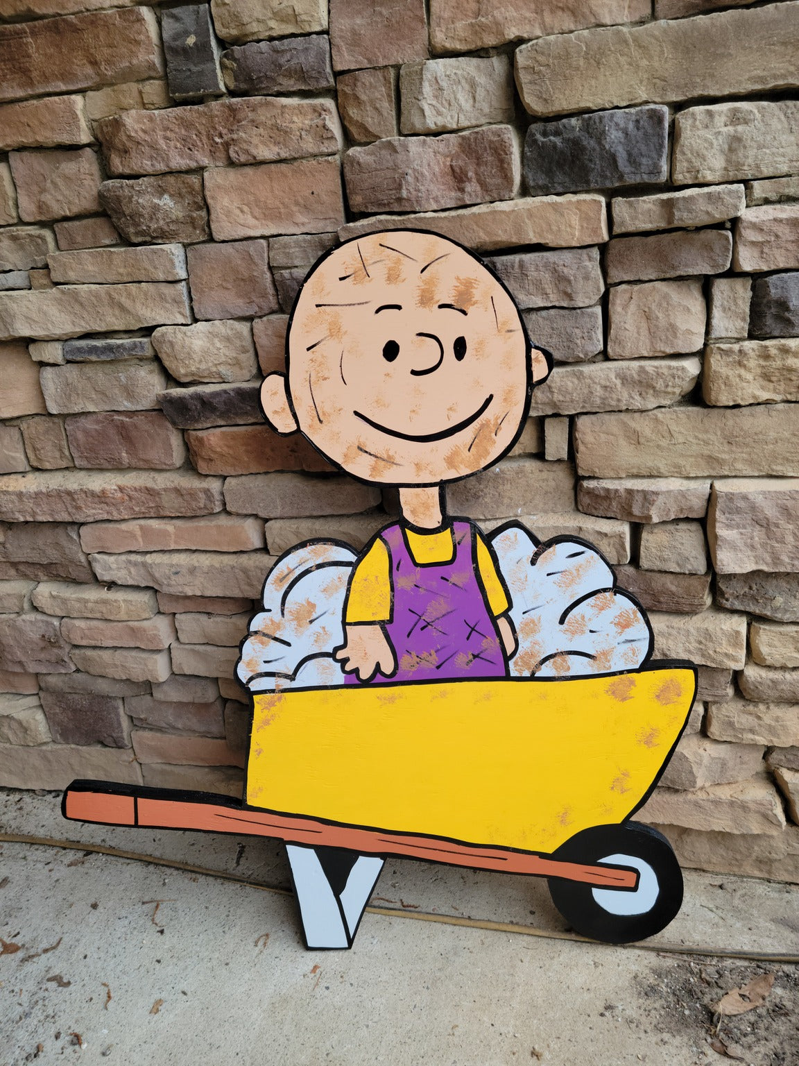 Pigpen in wheelbarrow yard art