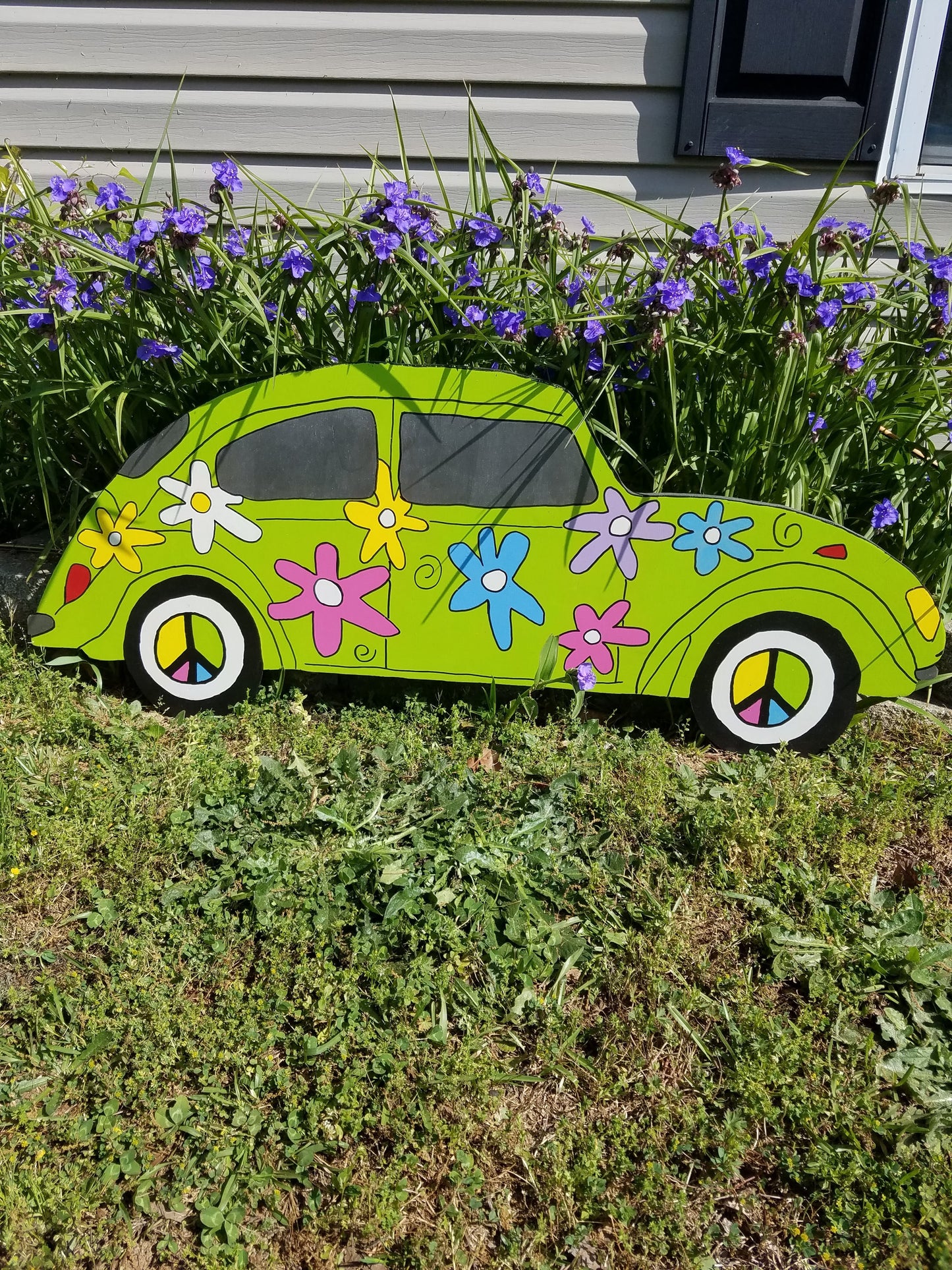 VW Bug flower power yard art