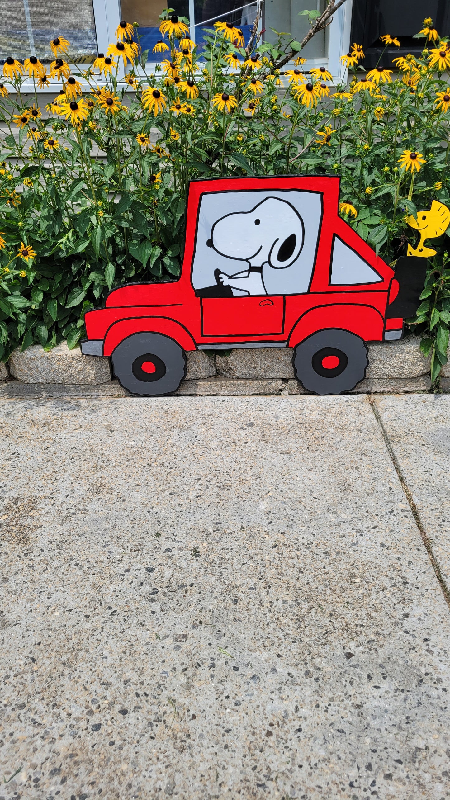 Snoopy driving jeep yard art