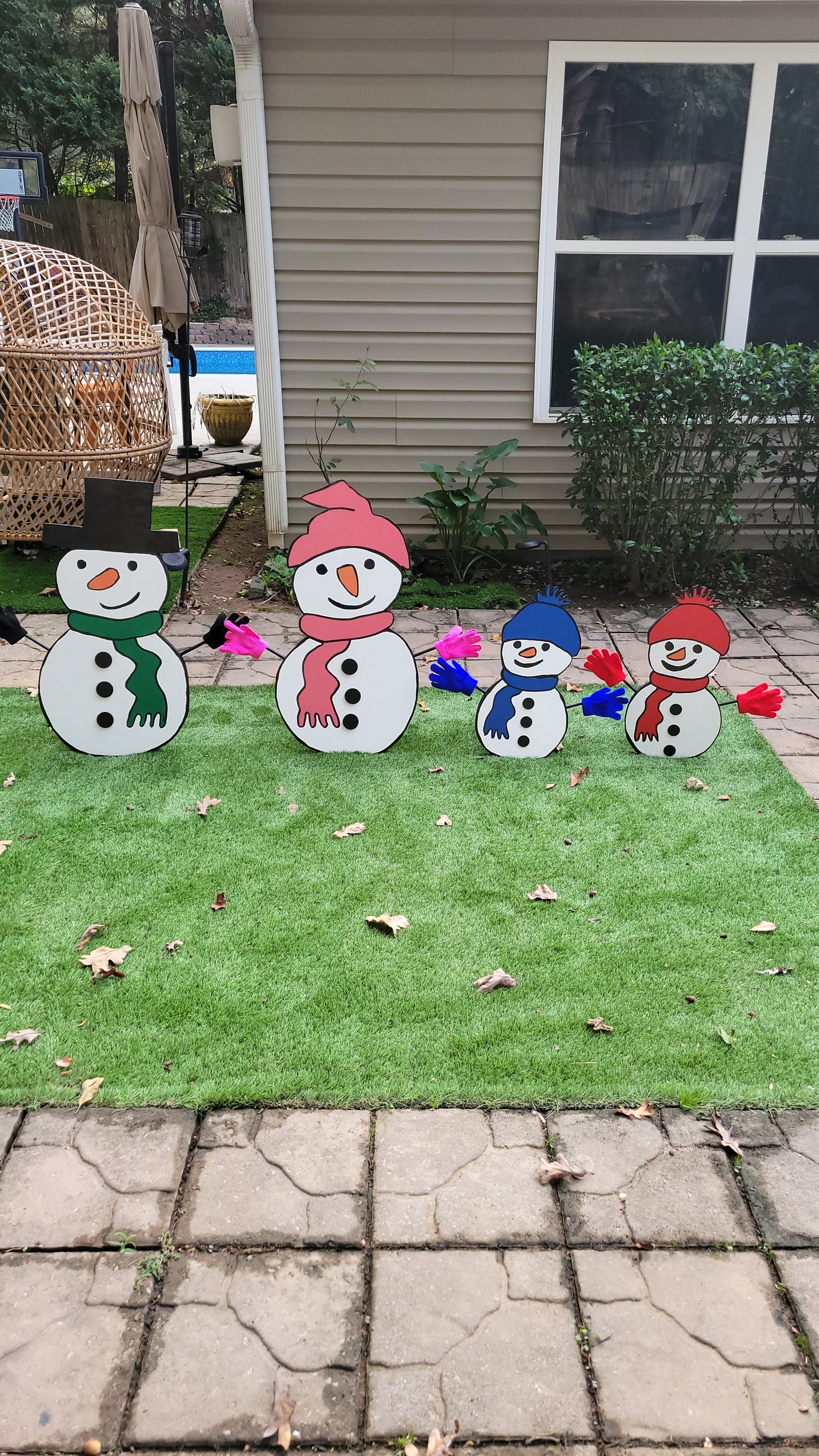 Snowman family Christmas yard art display