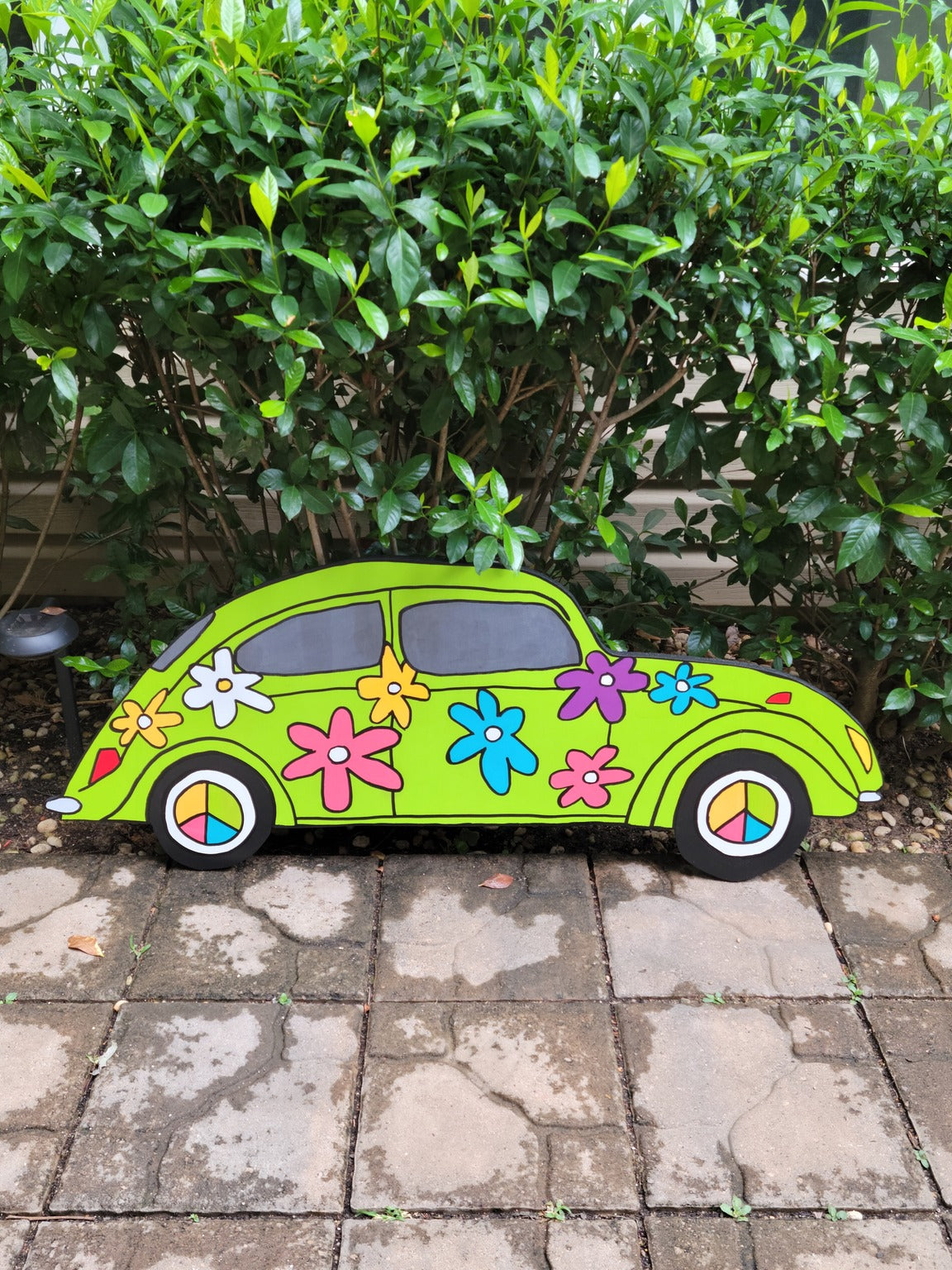 VW Bug flower power yard art