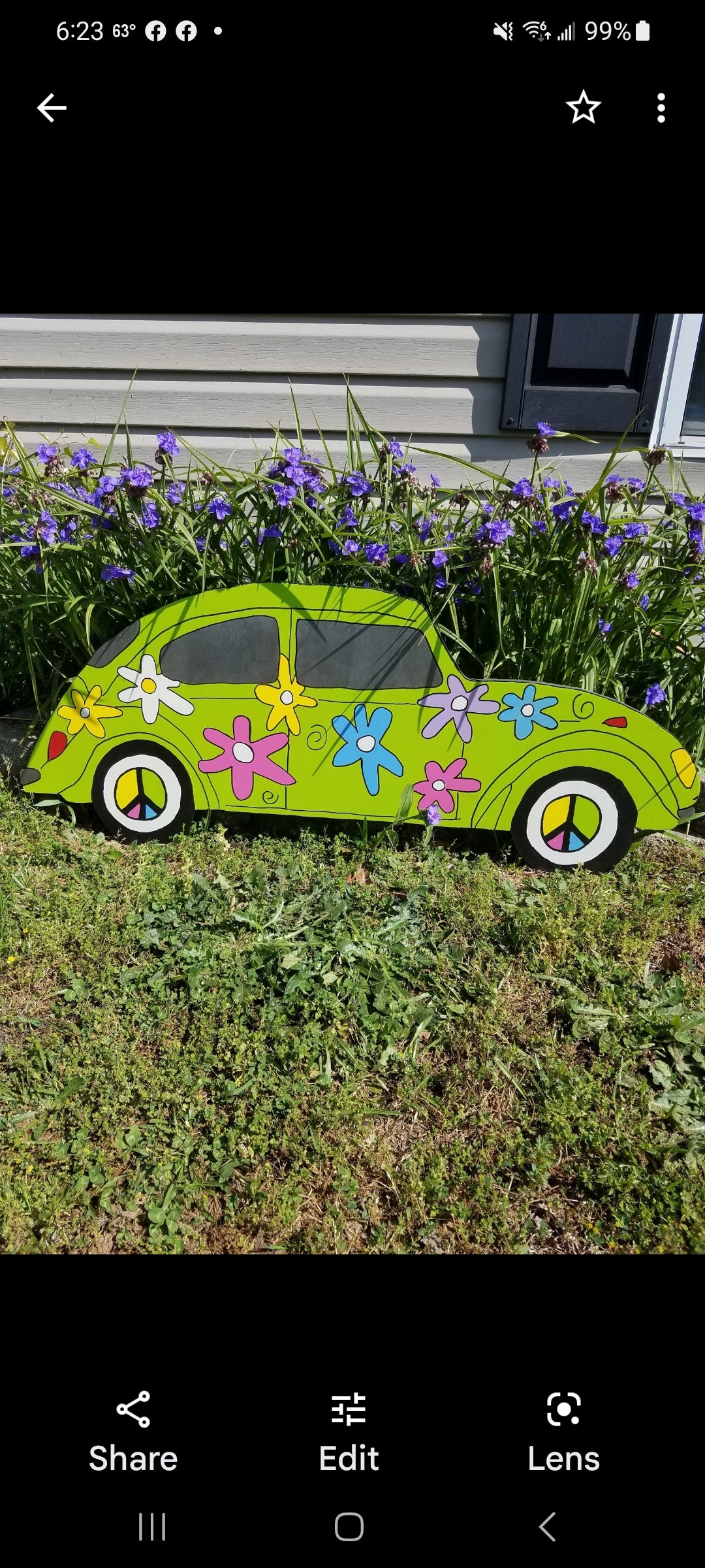 VW Bug flower power yard art